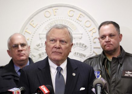 Georgia Governor Nathan Deal (C), speaks to the media as Public Safety Director Mark McDonough (L), and Georgia National Guard Director Gene Georgia Governor Nathan Deal (C), speaks to the media as Public Safety Director Mark McDonough (L), and Georgia National Guard Director Gene