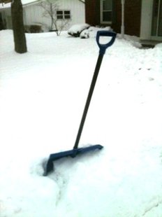 Snow shovel in snow bank Snow shovel in snow bank