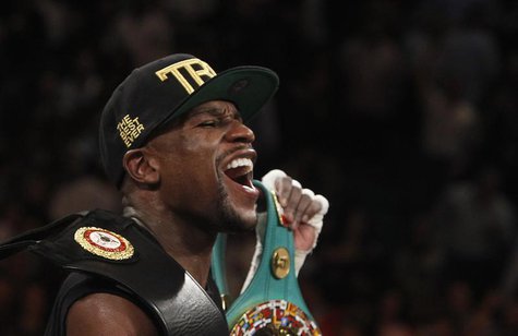 Floyd Mayweather Jr. of the U.S. celebrates his victory over WBC/WBA 154-pound champion Canelo Alvarez at the MGM Grand Garden Arena in Las Floyd Mayweather Jr. of the U.S. celebrates his victory over WBC/WBA 154-pound champion Canelo Alvarez at the MGM Grand Garden Arena in Las