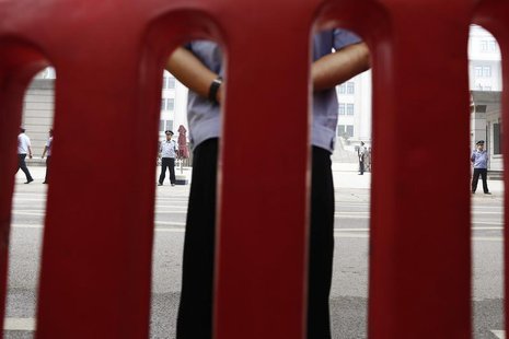 Policemen guard the entrance of the Jinan Intermediate People's Court where the trial of disgraced Chinese politician Bo Xilai will be held, Policemen guard the entrance of the Jinan Intermediate People's Court where the trial of disgraced Chinese politician Bo Xilai will be held,