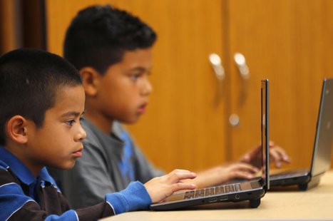 Grade four students work on laptop computers at Monarch School in San Diego, California October 8, 2013. REUTERS/Mike Blake Grade four students work on laptop computers at Monarch School in San Diego, California October 8, 2013. REUTERS/Mike Blake