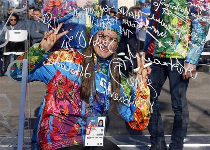 Russian pole vaulter and Mayor of the Coastal Cluster Olympic Village Yelena Isinbayeva gestures after signing the Olympic truce wall in Soc Russian pole vaulter and Mayor of the Coastal Cluster Olympic Village Yelena Isinbayeva gestures after signing the Olympic truce wall in Soc