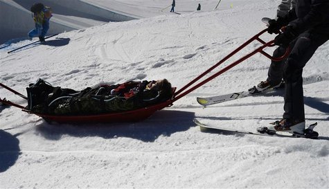 Snowboarder Torstein Horgmo of Norway is carried on a stretcher after falling on the slopestyle snowboard course during practice for the 201 Snowboarder Torstein Horgmo of Norway is carried on a stretcher after falling on the slopestyle snowboard course during practice for the 201