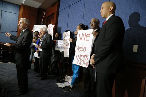 Senator Jack Reed (L) (D-RI) and U.S. Senator Cory Booker (D-NJ) hold a news conference with unemployed Americans to highlight their politic Senator Jack Reed (L) (D-RI) and U.S. Senator Cory Booker (D-NJ) hold a news conference with unemployed Americans to highlight their politic