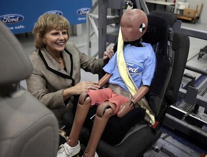 Ford Motor Vice President, Sustainability, Environment and Safety Engineering Sue Cischke shows off a child crash test dummy strapped in a S Ford Motor Vice President, Sustainability, Environment and Safety Engineering Sue Cischke shows off a child crash test dummy strapped in a S