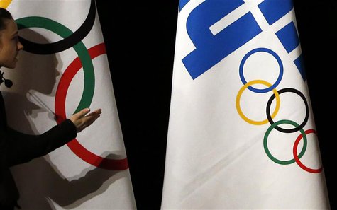 A technician gestures before the opening ceremony of the 126th IOC session in Sochi, February 4, 2014. REUTERS/Eric Gaillard A technician gestures before the opening ceremony of the 126th IOC session in Sochi, February 4, 2014. REUTERS/Eric Gaillard