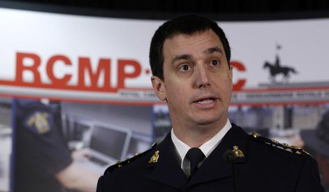 Royal Canadian Mounted Police (RCMP) Assistant Commissioner Gilles Michaud delivers a statement in Ottawa February 4, 2014. REUTERS/Chris Wa Royal Canadian Mounted Police (RCMP) Assistant Commissioner Gilles Michaud delivers a statement in Ottawa February 4, 2014. REUTERS/Chris Wa