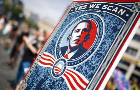 A protester holds a placard showing U.S. President Barack Obama with the phrase ''Yes we scan'' during a demonstration against the National Security Agency (NSA) and in support of U.S. whistleblower Edward Snowden in Frankfurt, July 27, 2013.
CREDIT: REUTERS/ KAI PFAFFENBACH A protester holds a placard showing U.S. President Barack Obama with the phrase ''Yes we scan'' during a demonstration against the National Security Agency (NSA) and in support of U.S. whistleblower Edward Snowden in Frankfurt, July 27, 2013.
CREDIT: REUTERS/ KAI PFAFFENBACH
