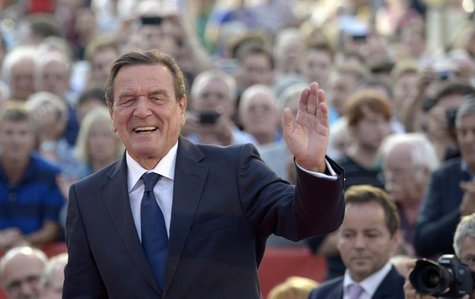 Former German Chancellor Gerhard Schroeder greets the audience as he supports Social Democratic top candidate Peer Steinbrueck (SPD) (not pi Former German Chancellor Gerhard Schroeder greets the audience as he supports Social Democratic top candidate Peer Steinbrueck (SPD) (not pi