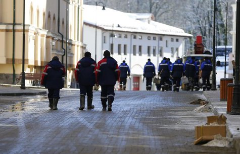 Construction workers walk through the mountain media village on top of the village of Esto Sadok at the Rosa Khutor alpine resort near Sochi Construction workers walk through the mountain media village on top of the village of Esto Sadok at the Rosa Khutor alpine resort near Sochi