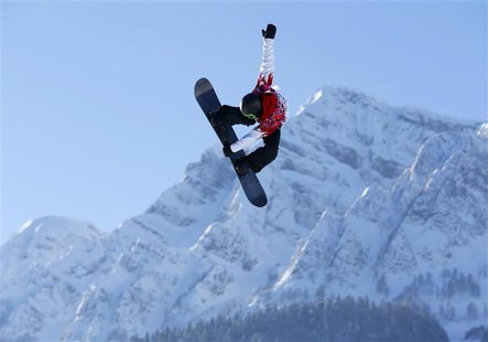 Canadian snowboarder Mark McMorris spins off a jump during slopestyle snowboard training at the 2014 Sochi Winter Olympics in Rosa Khutor, R Canadian snowboarder Mark McMorris spins off a jump during slopestyle snowboard training at the 2014 Sochi Winter Olympics in Rosa Khutor, R