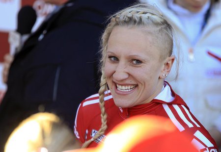 Canada's pilot Kaillie Humphries reacts after winning together with her brakewoman Chelsea Valois the 2-women competition at the FIBT Bobsle Canada's pilot Kaillie Humphries reacts after winning together with her brakewoman Chelsea Valois the 2-women competition at the FIBT Bobsle