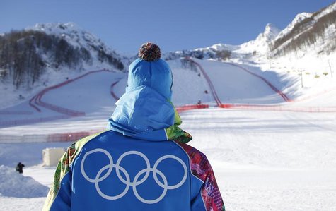 A volunteer looks up to the start of the downhill courses at the Rosa Khutor Alpine Skiing mountain resort ahead of the Sochi 2014 Winter Ol A volunteer looks up to the start of the downhill courses at the Rosa Khutor Alpine Skiing mountain resort ahead of the Sochi 2014 Winter Ol