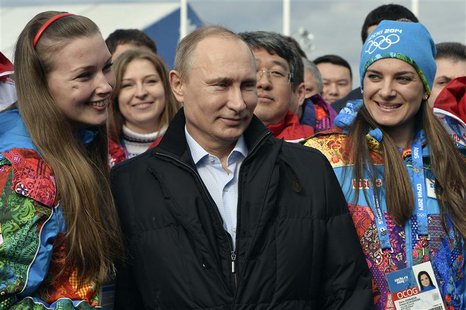 Russian President Vladimir Putin (C) and Olympic Village Mayor Elena Isinbaeva (R) visit the Coastal Cluster Olympic Village ahead of the So Russian President Vladimir Putin (C) and Olympic Village Mayor Elena Isinbaeva (R) visit the Coastal Cluster Olympic Village ahead of the So
