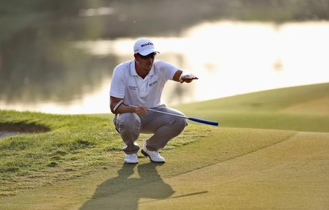 Henrik Stenson of Sweden lines the ball on the 16th green during the third round of the DP World Tour Championship in Dubai November 16, 201 Henrik Stenson of Sweden lines the ball on the 16th green during the third round of the DP World Tour Championship in Dubai November 16, 201