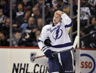 Tampa Bay Lightning's Steven Stamkos looks up at the score clock during a break in play against the Winnipeg Jets during the second period o Tampa Bay Lightning's Steven Stamkos looks up at the score clock during a break in play against the Winnipeg Jets during the second period o