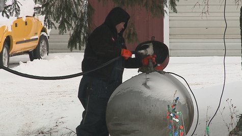 propane worker filling tank propane worker filling tank