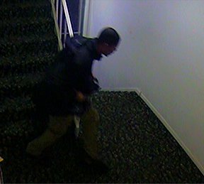 A suspect is seen in a still from surveillance footage. A suspect is seen in a still from surveillance footage.