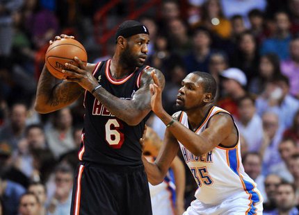 Jan 29, 2014; Miami, FL, USA; Miami Heat small forward LeBron James (6) is pressured by Oklahoma City Thunder small forward Kevin Durant (35 Jan 29, 2014; Miami, FL, USA; Miami Heat small forward LeBron James (6) is pressured by Oklahoma City Thunder small forward Kevin Durant (35