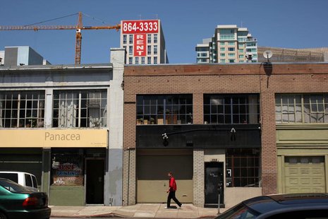 A man walks past warehouse lofts and new apartments in the South of Market area in San Francisco, California May 25, 2012. REUTERS/Robert Ga A man walks past warehouse lofts and new apartments in the South of Market area in San Francisco, California May 25, 2012. REUTERS/Robert Ga