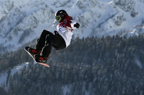 Canada's Sebastien Toutant performs a jump during the men's slopestyle snowboarding qualifying session at the 2014 Sochi Olympic Games in Ro Canada's Sebastien Toutant performs a jump during the men's slopestyle snowboarding qualifying session at the 2014 Sochi Olympic Games in Ro
