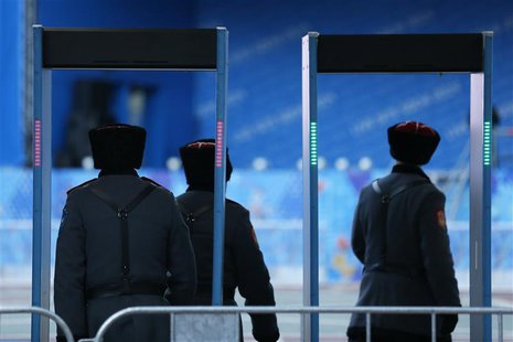 Russian Cossacks enter a security checkpoint as preparations continue for the 2014 Sochi Winter Olympics in Rosa Khutor February 6, 2014. RE Russian Cossacks enter a security checkpoint as preparations continue for the 2014 Sochi Winter Olympics in Rosa Khutor February 6, 2014. RE