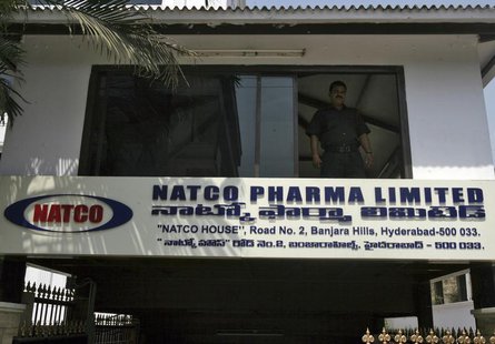 A private security guard looks out from a window of the head office of Natco in the southern Indian city of Hyderabad March 13, 2012. REUTER A private security guard looks out from a window of the head office of Natco in the southern Indian city of Hyderabad March 13, 2012. REUTER