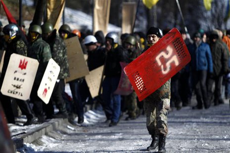 Anti-government protesters march on the street in Kiev February 6, 2014. REUTERS/David Mdzinarishvili Anti-government protesters march on the street in Kiev February 6, 2014. REUTERS/David Mdzinarishvili