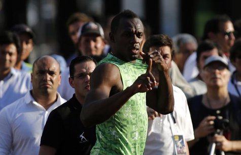 Jamaican sprinter Usain Bolt gestures before competing in a race against a public bus during a demonstration event in Buenos Aires December Jamaican sprinter Usain Bolt gestures before competing in a race against a public bus during a demonstration event in Buenos Aires December