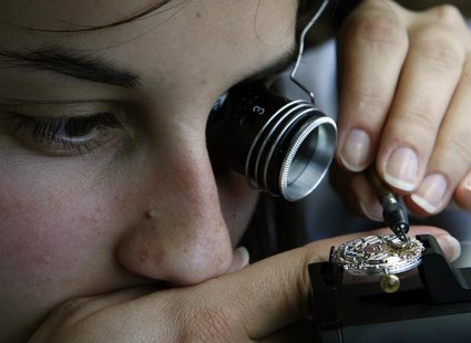 A Vacheron Constantin watchmaker adjusts a movement in the company headquarters in Plan-les-Ouates near Geneva May 23, 2007. REUTERS/Denis B A Vacheron Constantin watchmaker adjusts a movement in the company headquarters in Plan-les-Ouates near Geneva May 23, 2007. REUTERS/Denis B