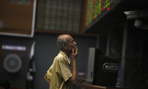 A man reacts as he monitors share prices during a trading session at the Karachi Stock Exchange May 21, 2013. REUTERS/Akhtar Soomro A man reacts as he monitors share prices during a trading session at the Karachi Stock Exchange May 21, 2013. REUTERS/Akhtar Soomro