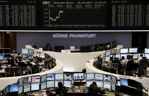 Traders are pictured at their desks in front of the DAX board at the Frankfurt stock exchange February 6, 2014. REUTERS/Remote/Stringer Traders are pictured at their desks in front of the DAX board at the Frankfurt stock exchange February 6, 2014. REUTERS/Remote/Stringer