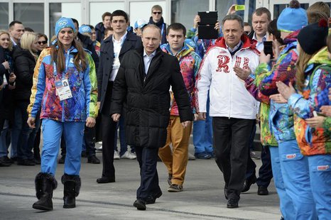 (From L to R) Olympic Village Mayor Elena Isinbaeva, Russian President Vladimir Putin and Russian Minister of Sport, Tourism and Youth polic (From L to R) Olympic Village Mayor Elena Isinbaeva, Russian President Vladimir Putin and Russian Minister of Sport, Tourism and Youth polic