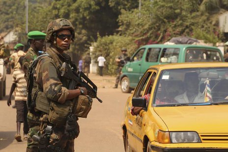 A French soldier carries his weapon as he takes a strategic position during a joint Chad MISCA French army patrol in Wouango district Januar A French soldier carries his weapon as he takes a strategic position during a joint Chad MISCA French army patrol in Wouango district Januar
