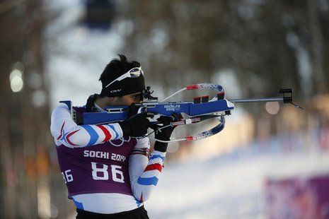 Martin Fourcade of France takes part in a biathlon training session for the 2014 Sochi Winter Olympic Games at the "Laura" cross-country and Martin Fourcade of France takes part in a biathlon training session for the 2014 Sochi Winter Olympic Games at the "Laura" cross-country and