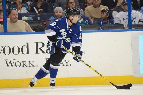 Jan 18, 2014; Tampa, FL, USA; Tampa Bay Lightning right wing Martin St. Louis (26) moves the puck up the ice against the San Jose Sharks at Jan 18, 2014; Tampa, FL, USA; Tampa Bay Lightning right wing Martin St. Louis (26) moves the puck up the ice against the San Jose Sharks at