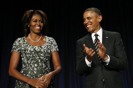 U.S. President Barack Obama applauds as he and First Lady Michelle Obama attend the National Prayer Breakfast in Washington February 6, 2014 U.S. President Barack Obama applauds as he and First Lady Michelle Obama attend the National Prayer Breakfast in Washington February 6, 2014