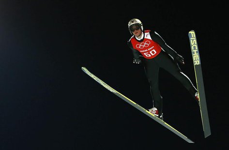 Austria's Thomas Morgenstern soars through the air during the men's ski jumping individual normal hill training event of the Sochi 2014 Wint Austria's Thomas Morgenstern soars through the air during the men's ski jumping individual normal hill training event of the Sochi 2014 Wint