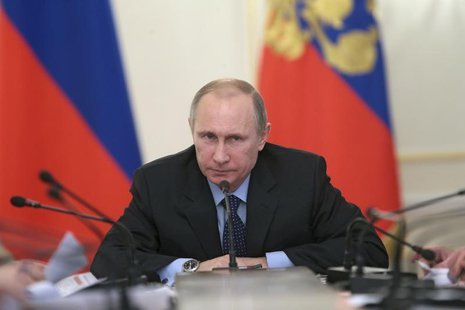 Russia's President Vladimir Putin (R) chairs a session of the Economic Council Presidium at the Novo-Ogaryovo state residence outside Moscow Russia's President Vladimir Putin (R) chairs a session of the Economic Council Presidium at the Novo-Ogaryovo state residence outside Moscow