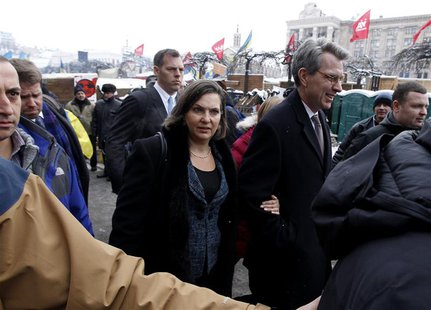 U.S. Assistant Secretary of State for European and Eurasian Affairs Victoria Nuland (C) and U.S. Ambassador Geoffrey Pyatt walk in the oppos U.S. Assistant Secretary of State for European and Eurasian Affairs Victoria Nuland (C) and U.S. Ambassador Geoffrey Pyatt walk in the oppos