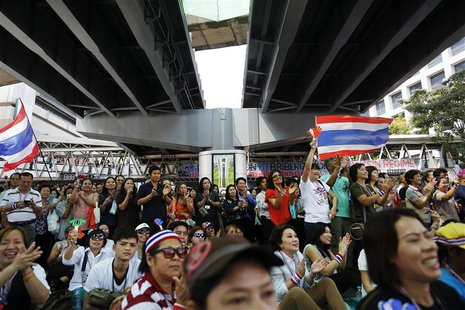 Anti-government protesters listen to their leader's speech under a bridge at the main intersection in downtown Bangkok February 6, 2014. REU Anti-government protesters listen to their leader's speech under a bridge at the main intersection in downtown Bangkok February 6, 2014. REU