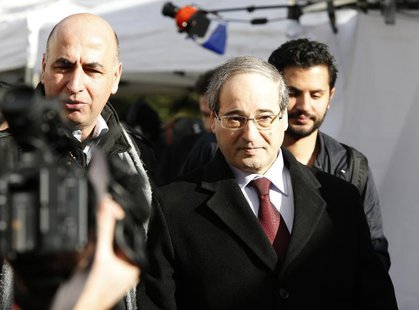 Syria's Deputy Foreign Minister Faisal Mekdad (C), who is a part of a Syrian government delegation, arrives for a meeting with U.N.-Arab Lea Syria's Deputy Foreign Minister Faisal Mekdad (C), who is a part of a Syrian government delegation, arrives for a meeting with U.N.-Arab Lea