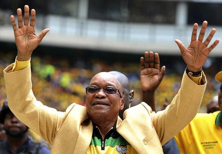 South Africa's President and leader of the ruling ANC party Jacob Zuma (C) greets his supporters as he arrives for the launch of his party's South Africa's President and leader of the ruling ANC party Jacob Zuma (C) greets his supporters as he arrives for the launch of his party's