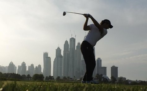Edoardo Molinari from Italy takes his tee shot on the 8th hole during the first round of the 2014 Omega Dubai Desert Classic in Dubai Januar Edoardo Molinari from Italy takes his tee shot on the 8th hole during the first round of the 2014 Omega Dubai Desert Classic in Dubai Januar