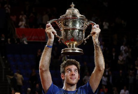 Juan Martin Del Potro of Argentina raises the winner's trophy after he won his final match against Switzerland's Roger Federer at the Swiss Juan Martin Del Potro of Argentina raises the winner's trophy after he won his final match against Switzerland's Roger Federer at the Swiss