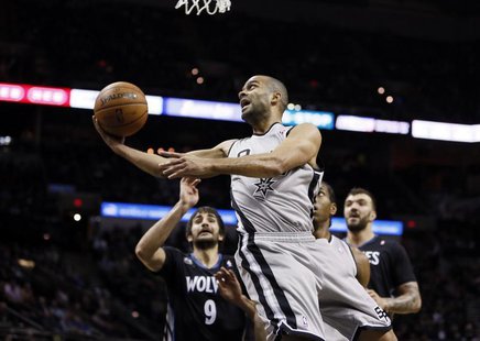 Jan 12, 2014; San Antonio, TX, USA; San Antonio Spurs guard Tony Parker (9) drives to the basket past Minnesota Timberwolves guard Ricky Rub Jan 12, 2014; San Antonio, TX, USA; San Antonio Spurs guard Tony Parker (9) drives to the basket past Minnesota Timberwolves guard Ricky Rub