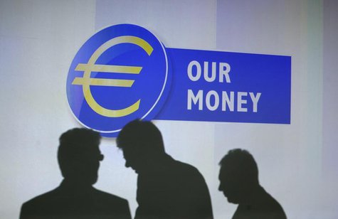 Guests of the presentation of the new 10 euro banknote throw a shadow on a video projection at the European Central Bank headquarters in Fra Guests of the presentation of the new 10 euro banknote throw a shadow on a video projection at the European Central Bank headquarters in Fra