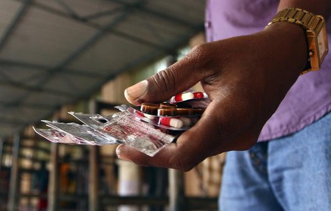 A patient holds free medicine in Chennai July 12, 2012. REUTERS/Babu A patient holds free medicine in Chennai July 12, 2012. REUTERS/Babu
