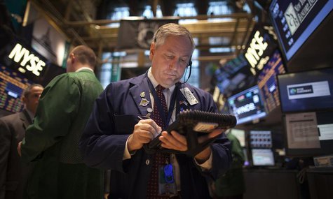 A trader works on the floor of the New York Stock Exchange during the opening bell in New York, November 27, 2013. REUTERS/Carlo Allegri A trader works on the floor of the New York Stock Exchange during the opening bell in New York, November 27, 2013. REUTERS/Carlo Allegri