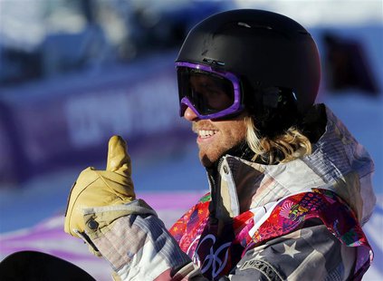 Sage Kotsenburg of the U.S. gestures after arriving on the finish line during the men's snowboard slopestyle semi-final competition at the 2 Sage Kotsenburg of the U.S. gestures after arriving on the finish line during the men's snowboard slopestyle semi-final competition at the 2
